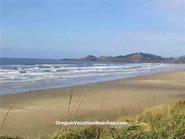 Oregon coast sandy beach + Yaquina Head Lighthouse